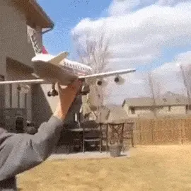 boy throwing a plastic plane
